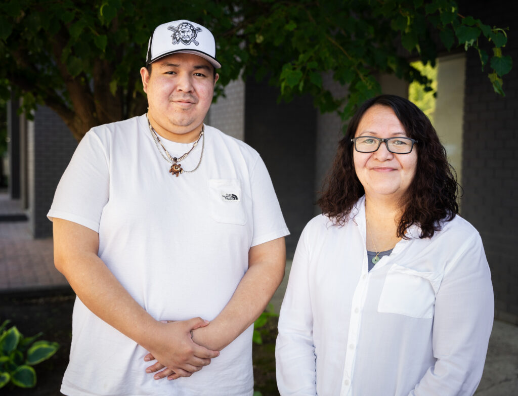 Portrait of an adult First Nations son and his mother who are an FPCC Mentor-Apprentice Team engaged in First Nations languages immersion program